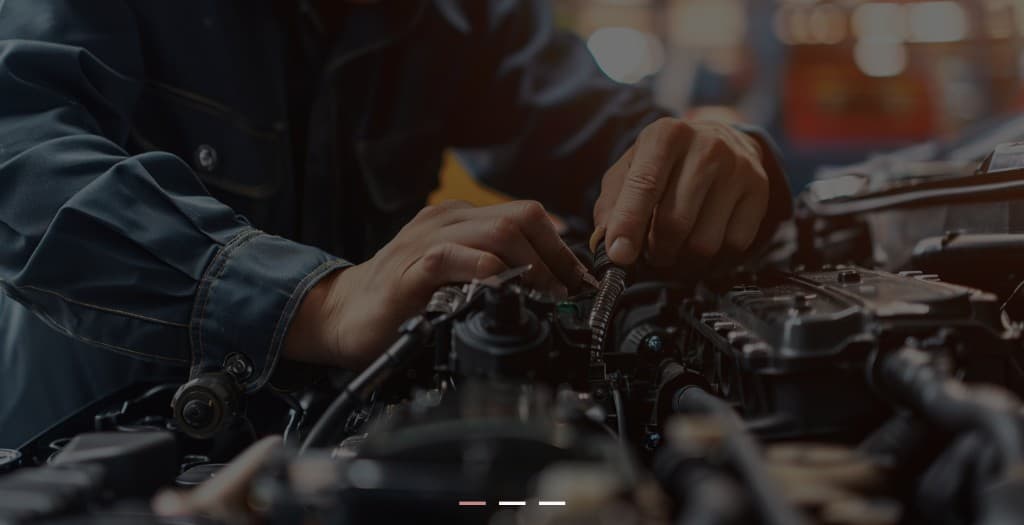 Mechanic working on car engine