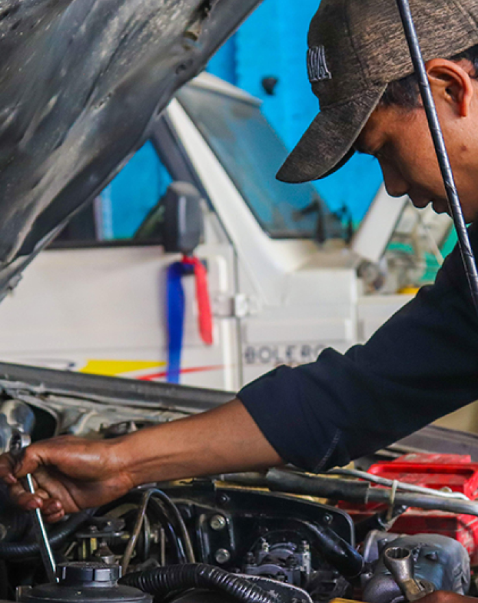 Mechanic working on vehicle